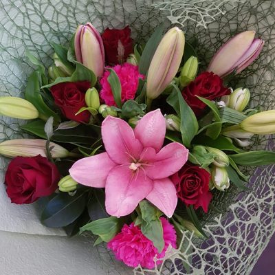 Bouquet of flowers wrapped in hessian