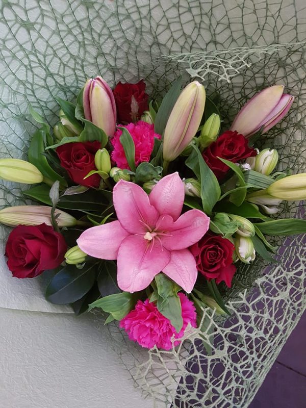 Bouquet of flowers wrapped in hessian