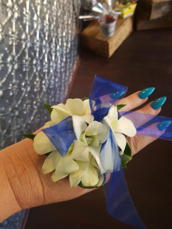 a blue and white corsage