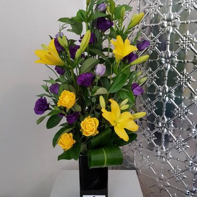 Arrangement of flowers in ceramic vessel