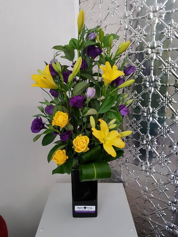 Arrangement of flowers in ceramic vessel