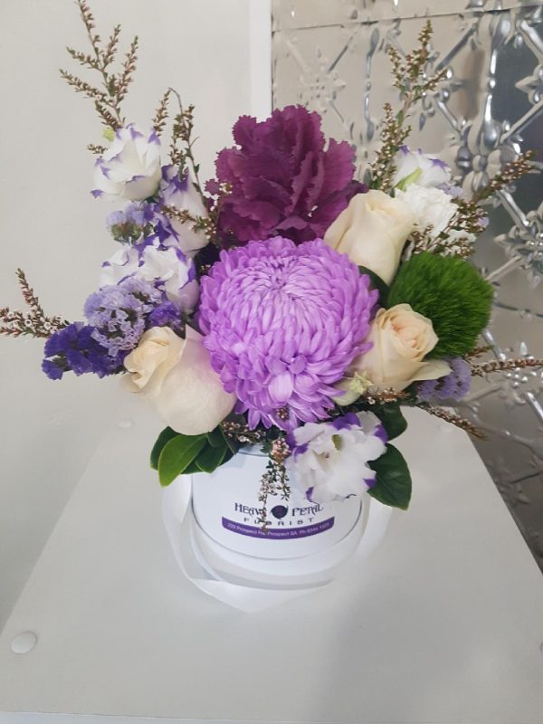 Arrangement of flowers in hat box