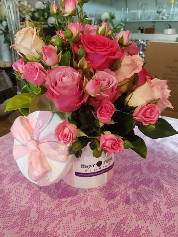 Arrangement of flowers in hat box