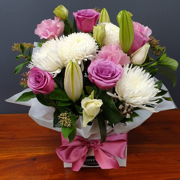 A box of pink and white flowers.